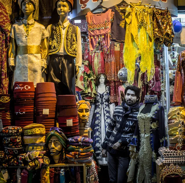 Ekrem Turkmen poses for a portrait in his store selling Ottoman Traditional clothing inside the Istanbul Grand Bazaar on January 7, 2016 in Istanbul, Turkey. Istanbul's Grand Bazaar is one of the oldest covered markets in the world and hosts more than 3,000 stores. It is estimated that more than 250,000 people visit the bazaar each day. Despite an increase in new modern shopping malls, the beauty and tradition of the Grand Bazaar continues to be an advantage, in 2014 it was listed as the world's most visited tourist attraction. (Photo by Chris McGrath/Getty Images)