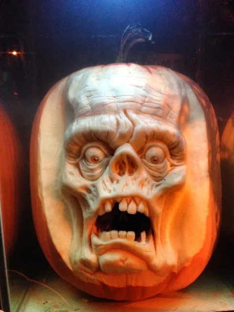 A horror face carved out of a pumpkin by Ray Villafane and team in Bellaire, Michigan. (Photo by Ray Villafane/Barcroft Media)