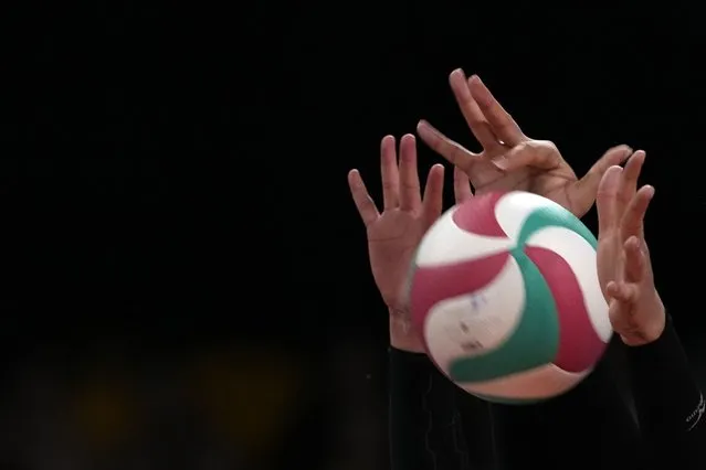 The hands of Mexico's Karen Rivera and teammate Karina Flores block the ball during a women's Volleyball semifinal match against Brazil at the Pan American Games in Santiago, Chile, Wednesday, October 25, 2023. (Photo by Moises Castillo/AP Photo)