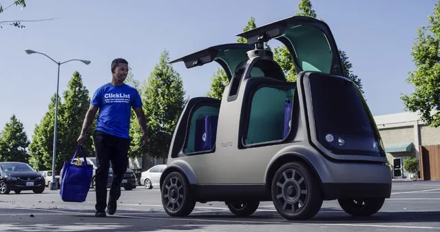 This undated image provided by The Kroger Co. shows an autonomous vehicle called the R1. Nuro and grocery chain Kroger are teaming up to bring unmanned delivery service to customers. The companies said Tuesday, December 18, 2018, that Nuro's unmanned vehicle, the R1, will be added to a fleet of autonomous Prius vehicles that have run self-driving grocery delivery service in Scottsdale, Ariz., with vehicle operators since August. (Photo by Andrew Brown/The Kroger Co. via AP Photo)