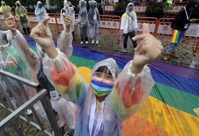 A participant cheers during the annual Taiwan LGBT Pride parade in Taipei, Taiwan, Saturday, October 29, 2022. (Photo by Chiang Ying-ying/AP Photo)