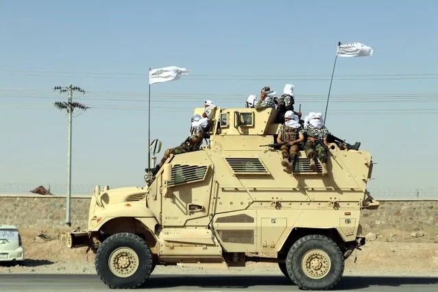 Taliban forces rally to celebrate the withdrawal of US forces in Kandahar, Afghanistan, 01 September 2021. The Taliban called for support from the international community to revive an economy battered by two decades of conflict and heavily dependent on foreign aid. chief Taliban spokesman Zabihullah Mujahid said one of the main objectives after the Taliban's “victory” is the reconstruction of the country and assured that the international community must trust that the aid to Afghanistan under the Taliban will be directed through “proper channels”. (Photo by EPA/EFE/Strimger)