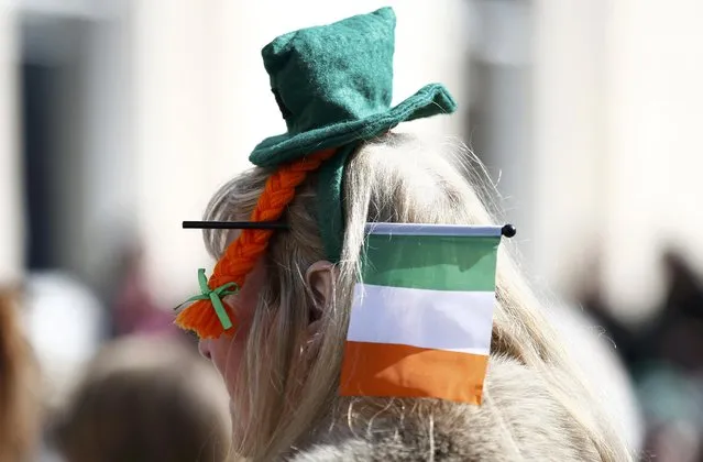 A participant wearing the colours of Ireland takes part in the St. Patrick's Day Parade as it processes through central London, Britain March 13, 2016. (Photo by Peter Nicholls/Reuters)