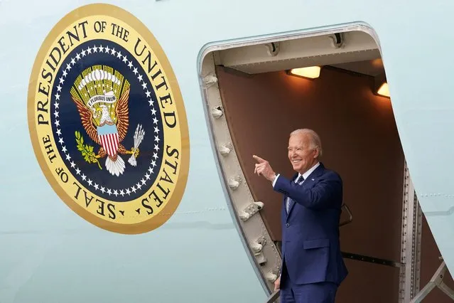 U.S. President Joe Biden points as he steps down from Air Force One, during his arrival in Los Angeles, California, U.S., February 20, 2024. (Photo by Kevin Lamarque/Reuters)