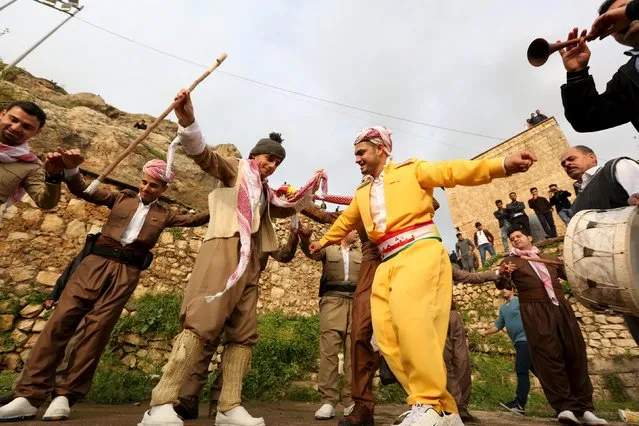 Iraqi Kurdish men celebrate Newroz Day, a festival marking spring and the new year, in Akra, Iraq March 20, 2016. (Photo by Ari Jalal/Reuters)