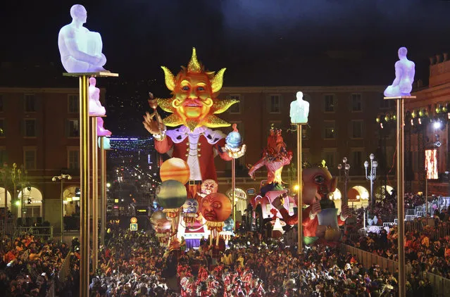 The King of Energy float leads the Queen and other floats during the Nice Carnival 2017 parade, Saturday, February 11, 2017, in Nice, southeastern France. Behind barricades, the city of Nice was holding its Carnival, the 133rd edition, keeping up tradition but taking precautions seven months after the Bastille Day truck attack that killed 86. (Photo by Henri Grivot/AP Photo)