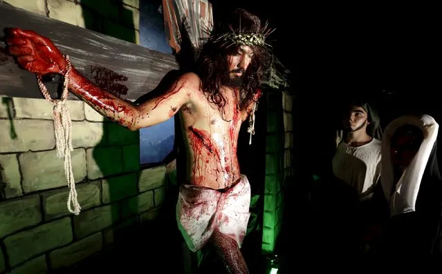 Actors take part in a re-enactment during a Holy Week procession to prepare for Good Friday celebration in Luque city, Paraguay March 23, 2016. (Photo by Jorge Adorno/Reuters)