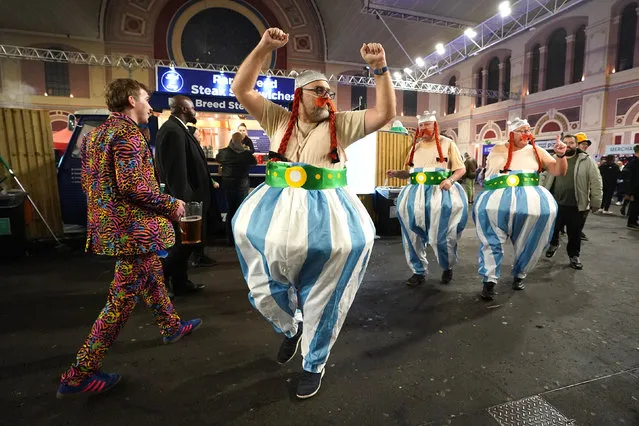 Fans in fancy dress ahead of the final of the Cazoo World Darts Championship at Alexandra Palace, London on Tuesday, January 3, 2023. (Photo by Zac Goodwin/PA Wire)