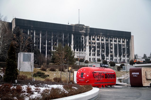 A photograph taken on January 10, 2022 shows a general view of a burnt-out Almaty City Administration building in central Almaty, following violent protests over the price increase of the fuel. Ex-Soviet Kazakhstan was observing on January 10, 2022 a day of national mourning, following the worst unrest in the republic's independent history. The National Security Committee said in a statement that the country, including government and military facilities, was fully under the control  of security services. (Photo by Alexandr Bogdanov/AFP Photo)