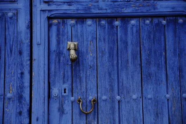 A door painted in the traditional indigo Manchegan style is seen in the hometown of Don Quixote's ladyship Dulcinea, in El Toboso, Spain, April 6, 2016. (Photo by Susana Vera/Reuters)