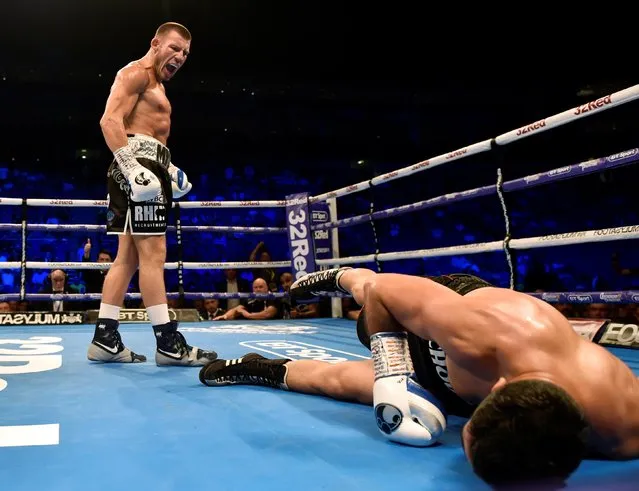 Liam Williams (L) knocks down Karim Achour during the WBC Silver Middleweight Championship at the O2 Arena, London on July 13, 2019. (Photo by Adam Holt/Action Images via Reuters)