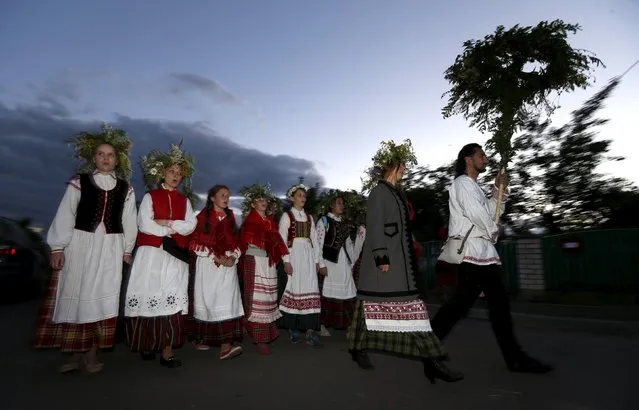 Belarusian people take part in the Ivan Kupala festival near the town of Rakov, west of Minsk June 27, 2015. (Photo by Vasily Fedosenko/Reuters)