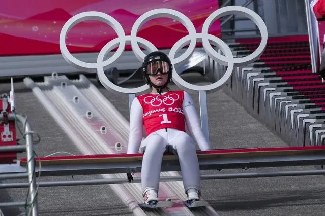 Anna Hoffmann, of the United States, prepares for her jump during a women's normal hill ski jumping training session at the 2022 Winter Olympics, Friday, February 4, 2022, in Zhangjiakou, China. (Photo by Matthias Schrader/AP Photo)