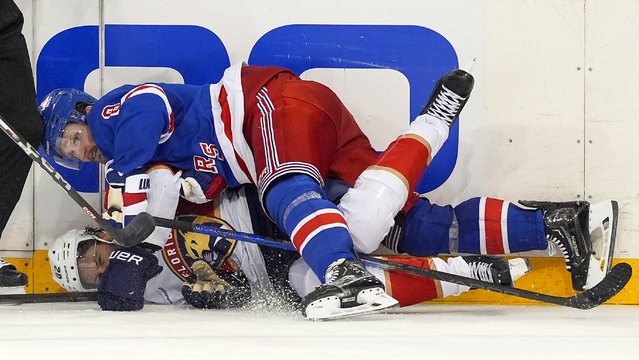 New York Rangers defenseman Jacob Trouba (8) and Florida Panthers center Kevin Stenlund (82) collide during the third period of Game 1 of the NHL hockey Eastern Conference Stanley Cup playoff finals, Wednesday, May 22, 2024, in New York. (Photo by Julia Nikhinson/AP Photo)