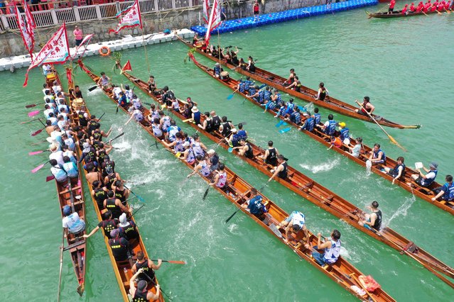 This aerial photo shows rowers in their dragon boats at Tai O fishing village on Lantau Island in Hong Kong on June 10, 2024 as they take part in the dragon boat races held to celebrate the Tuen Ng Festival (Dragon Boat Festival). (Photo by Peter Parks/AFP Photo)