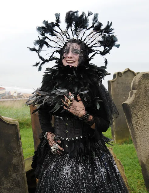 Debra Scarsbrook stands in the grounds of St Mary's Church, Whitby, during the Whitby Gothic festival taking place this weekend, on  April 27, 2014. The twice yearly event attracts Goths from across the UK and beyond to the historic fishing town and is a great boost to the local economy. (Photo by Anna Gowthorpe/PA Wire)