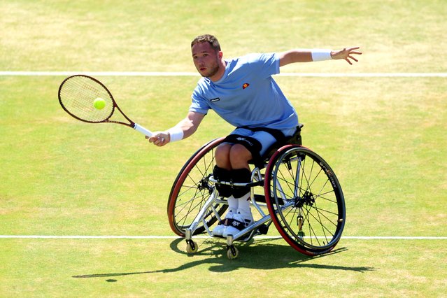 Alfie Hewett of Great Britain plays a forehand against Gordon Reid of Great Britain during the Wheelchair Singles match on Day Seven of the cinch Championship at The Queen's Club on June 23, 2024 in London, England. (Photo by Luke Walker/Getty Images for LTA)