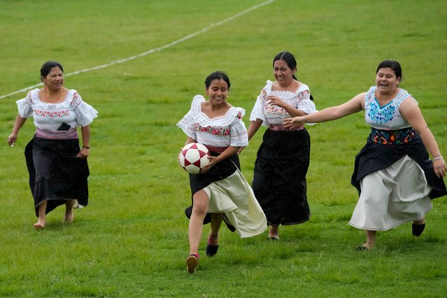 Indigenous women fight for the ball during a “handball with anaco” match in the Indigenous community of Turucu, Ecuador, Friday, June 14, 2024. One year ago, a group of women decided to create a new version of soccer: handball with anaco, an ancient skirt worn by Indigenous women. (Photo by Dolores Ochoa/AP Photo)