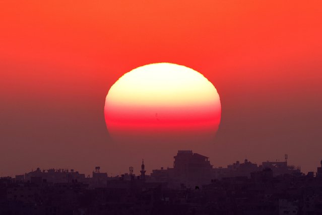 The sun sets over the Gaza Strip, amid the ongoing conflict between Israel and Hamas, as seen from Israel on June 5, 2024. (Photo by Amir Cohen/Reuters)