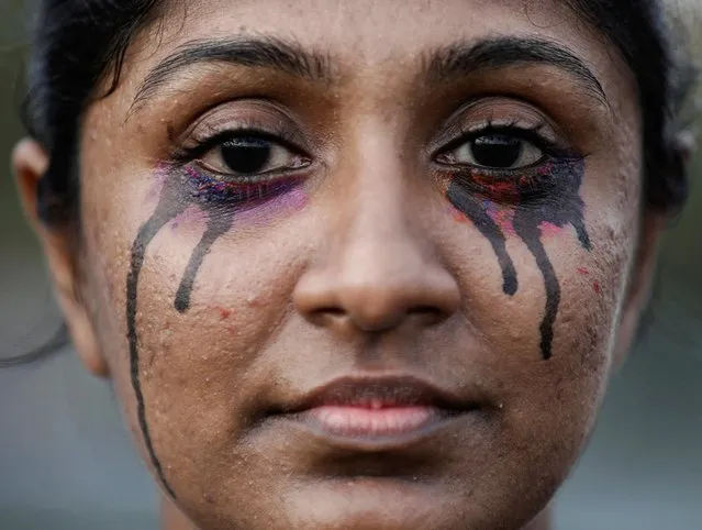 A demonstrator is seen during a protest against Sri Lanka President Gotabaya Rajapaksa in front of the Presidential secretariat, amid the country's economic crisis in Colombo, Sri Lanka, April 19, 2022. (Photo by Dinuka Liyanawatte/Reuters)