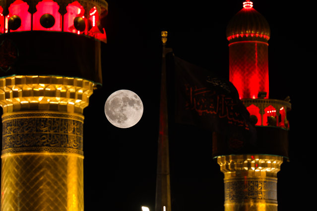 The moon rises in Najaf, Iraq on August 19, 2024. At its closest point, the full moon can appear up to 14% bigger and 30% brighter than the faintest moon of the year. (Photo by Karar Essa/Anadolu via Getty Images)