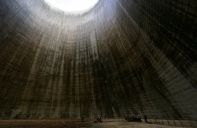 People listen to the South Bohemian Philharmonic Quartet performing inside a cooling tower at Temelin nuclear power plant near the town of Tyn nad Vltavou, Czech Republic, June 20, 2016. (Photo by David W. Cerny/Reuters)