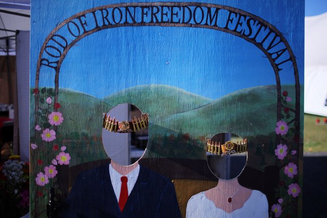 A board with cut-outs for faces is displayed for attendees to pose for photographs with a crown of bullets at the Rod of Iron Freedom Festival, in Greeley, Pennsylvania, on October 12, 2024. (Photo by Brian Snyder/Reuters)