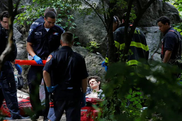 Medics tend to a man who was injured after an explosion in Central Park in Manhattan, New York, U.S., July 3, 2016. A “homemade” explosive left in Central Park for more than 24 hours blew off the foot of a college student Sunday, authorities said, raising fears on the eve of the Fourth of July. Connor Golden, 18, of Fairfax, Va., had just climbed down off a rock near E. 60th St. and Fifth Ave. about 10:52am when he stepped on the “shock-sensitive” explosive, Lt. Mark Torre, the commanding officer of the NYPD’s Bomb Squad, said. It was inside a black plastic bag when it exploded, a high-ranking police source said. (Photo by Andrew Kelly/Reuters)