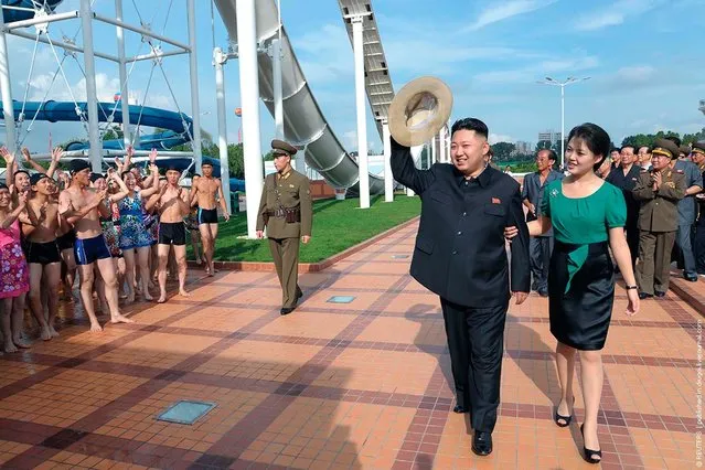 North Korean leader Kim Jong-Un and his wife Ri Sol-Ju attend the opening ceremony of the Rungna People's Pleasure Ground on Rungna Islet along the Taedong River in Pyongyang in this July 25, 2012 photograph released by the North's KCNA to Reuters on July 26, 2012. The Rungna People's Pleasure Ground has attractions such as a dolphinarium, a wading pool, a fun fair and a mini golf course, according to Korean Central News Agency. (Photo by KONA/Reuters)