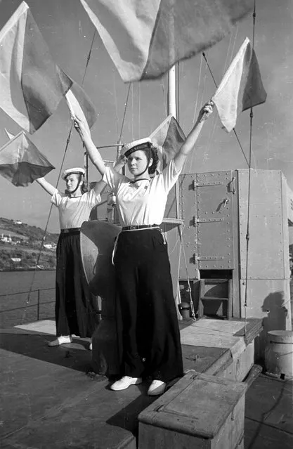 Sea-Ranger Girl Guides doing their semaphore practice on board the Motor Torpedo Boat 630 moored in the River Dart close to Dartmouth Naval College. 21st August 1948.  (Photo by Charles Hewitt/Picture Post)