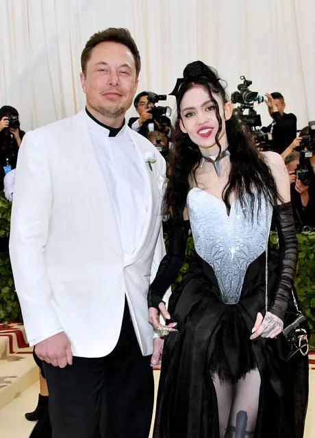 Elon Musk and his girlfriend Grimes attend the Heavenly Bodies: Fashion & The Catholic Imagination Costume Institute Gala at The Metropolitan Museum of Art on May 7, 2018 in New York City. (Photo by Dia Dipasupil/WireImage)