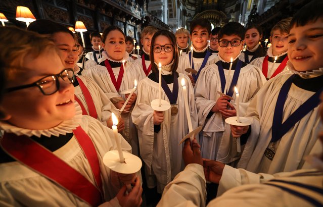 Choristers of St Paul’s Cathedral choir in UK prepare to take part in Christmas events in the last decade of December 2024. This year, girls have been admitted for the first time in the choir’s 900-year history. (Photo by Richard Pohle/The Times)