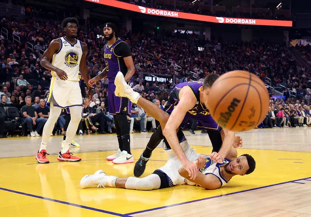 Matt Ryan #37 of the Los Angeles Lakers and Stephen Curry #30 of the Golden State Warriors compete for a loose ball during the 1st half of the game at Chase Center on October 18, 2022 in San Francisco, California. (Photo by Ezra Shaw/Getty Images)