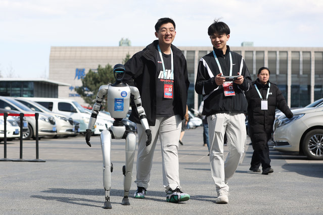 A Unitree's G1 humanoid robot walks during the 2025 Zhongguancun Forum Annual Conference at the Zhongguancun International Innovation Center on March 27, 2025 in Beijing, China. (Photo by Jiang Qiming/China News Service/VCG via Getty Images)