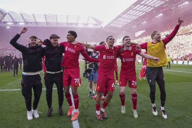 Liverpool players celebrate after winning the English Premier League soccer match between Liverpool and Tottenham Hotspur and clinching the Premier League title at Anfield in Liverpool, England, Sunday, April 27, 2025. (Photo by Jon Super/AP Photo)