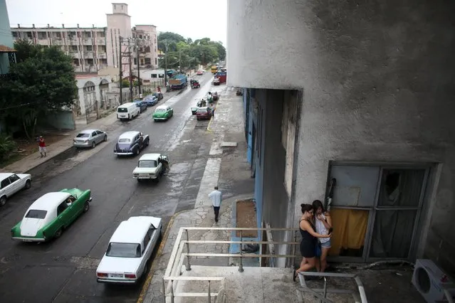 Girls use the internet to communicate at a Wi-Fi hotspot in Havana, September 22, 2015. Cuba's new Wi-Fi hotspots – 35 nationwide since July with more promised soon – are a sensation in a highly-controlled country with one of the world's lowest Internet penetrations. (Photo by Alexandre Meneghini/Reuters)