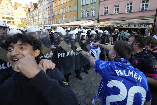 Riot police confront Chelsea fans ahead of the Europa Conference League final soccer match between Real Betis and Chelsea in Wroclaw, Poland, Tuesday, May 27, 2025. (Photo by Czarek Sokolowski/AP Photo)