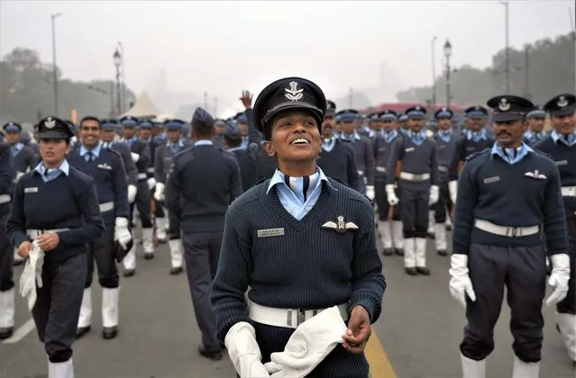 An Indian Air Force officer reacts as they rehearse to prepare for the upcoming Republic day parade amidst morning smog in New Delhi, India, Thursday, December 22, 2022. (Photo by Manish Swarup/AP Photo)