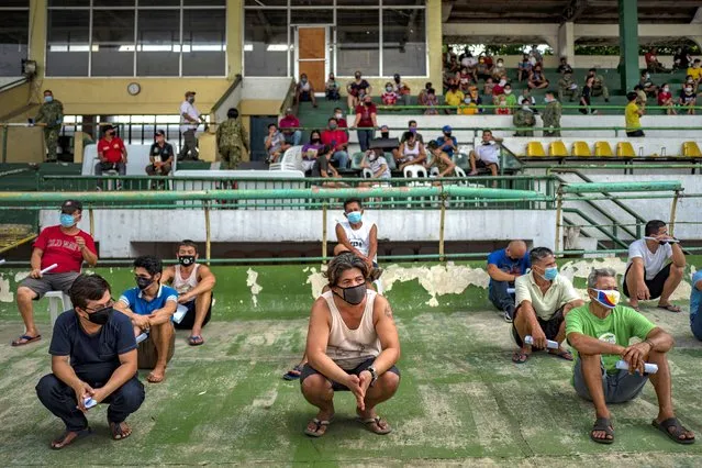 People arrested for not wearing face masks are detained at a stadium on July 8, 2020 in Quezon city, Metro Manila, Philippines. President Rodrigo Duterte expressed concern with reopening the country as it struggles to contain the spread of the coronavirus. With more than 45,000 cases and more than a thousand deaths, the Philippines is the second worst coronavirus-hit country in Southeast Asia, despite imposing the longest lockdown in the world surpassing a hundred days that has left millions of Filipinos jobless and hungry. (Photo by Ezra Acayan/Getty Images)