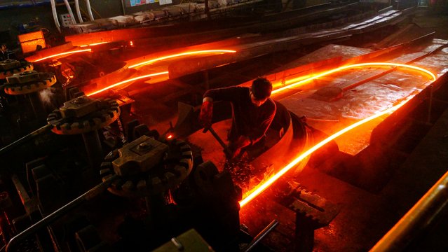 Molten steel rods at a Pak Iron re-rolling mill in Islamabad, Pakistan, on Tuesday, May 20, 2025. Pakistan's government lowered its economic growth projection for the fiscal year as global trade disruptions and tighter spending conditions by the International Monetary Fund weighed on the South Asian nation's economy. (Photo by Asad Zaidi/Bloomberg)