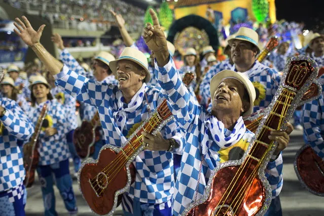 Performers from the Unidos de Vila Isabel samba school parade during Carnival celebrations at the Sambadrome in Rio de Janeiro, Tuesday, February 12, 2013. Rio de Janeiro's samba schools vied for the title of the year's best in an over-the-top, all-night-long Carnival parade at the city's iconic Sambadrome. (Photo by Felipe Dana/AP Photo)