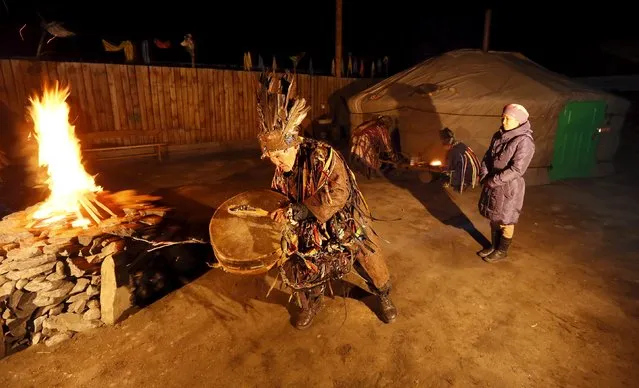 Shamans (L front, L back, R back), representing the so-called Adyg Eeren (Bear Spirit) society, participate in the so-called Kamlanie night ritual upon the request of customers, including local residents and foreigners, in the town of Kyzyl, the administrative centre of Tuva region, Southern Siberia, Russia, October 9, 2015. (Photo by Ilya Naymushin/Reuters)