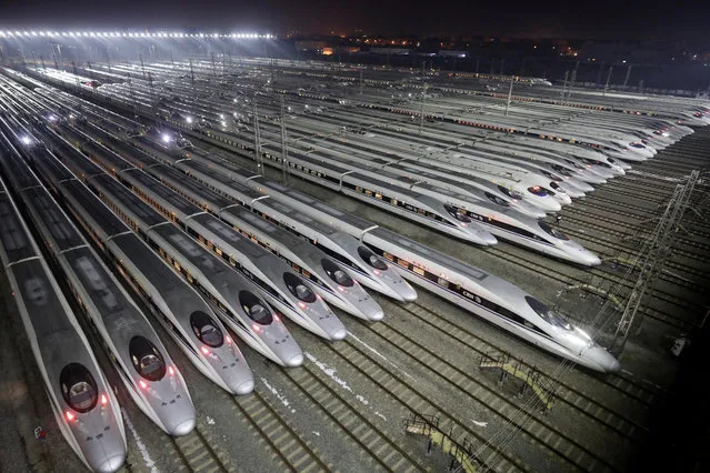 China Railway High-speed Harmony bullet trains are seen at a high-speed train maintenance base, as the Spring Festival travel rush begins, in Wuhan, Hubei province, China February 1, 2018. (Photo by Darley Shen/Reuters)