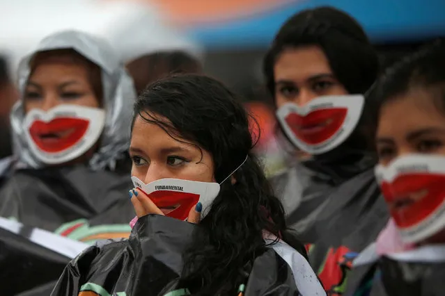 Pro-abortion activists wearing masks over their mouths demonstrate to demand the decriminalization of abortion in Mexico City, Mexico September 28, 2016. (Photo by Carlos Jasso/Reuters)