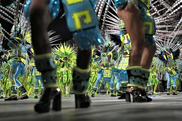 Performers from the Paraiso do Tuiuti samba school parade during Carnival celebrations at the Sambadrome in Rio de Janeiro, Brazil, Monday, February 20, 2023. (Photo by Silvia Izquierdo/AP Photo)