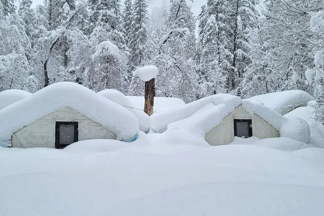 In this photo provided by the National Park Service, tents at Curry Village are covered with snow in Yosemite National Park, Calif., Tuesday, February 28, 2023. The park, closed since Saturday because of heavy, blinding snow, postponed its planned Thursday, March 2, 2023, reopening indefinitely. (Photo by National Park Service via AP Photo)