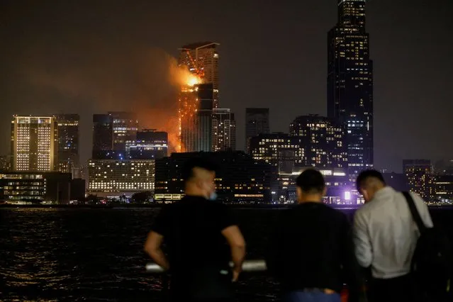 A building is seen on fire in Hong Kong, China on March 3, 2023. (Photo by Tyrone Siu/Reuters)
