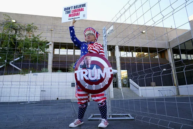 Supporter of President Donald Trump, Tara Immen, of Happy Valley, Ariz., protests in front of the Maricopa County Elections Department as the agency conducts a post-election logic and accuracy test for the general election Wednesday, November 18, 2020, in Phoenix. (Photo by Ross D. Franklin/AP Photo)