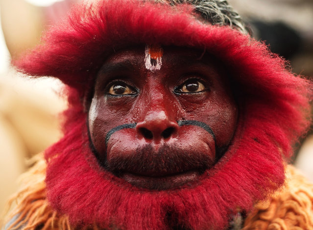 An Indian Hindu devotee dressed as a monkey takes part in a procession outside the Hanuman temple in New Delhi on the occasion of Hanuman Jayanti, the birthday of the Hindu monkey-god. Hanuman, known for his strength, is worshipped for his unyielding devotion to Lord Rama and is remembered for his selfless dedication to the diety. (Photo by Manan Vatsyayana/Getty Images)