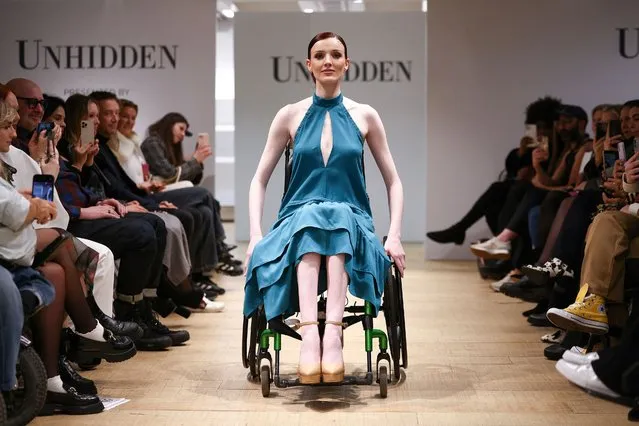 A model presents a creation during the “Unhidden: A New Era in Fashion” catwalk show, with designs presented by models who all live with a disability, chronic condition or visible difference, during London Fashion Week in London, Britain on February 17, 2023. (Photo by Henry Nicholls/Reuters)